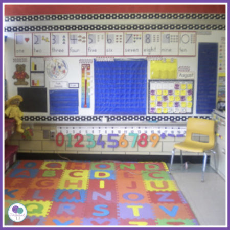 Kindergarten classroom with calendar on the wall. 
