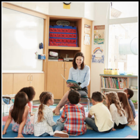 Teacher reading aloud to students