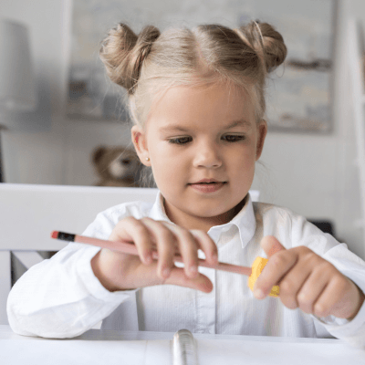 Student sharpening a pencil