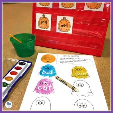 Halloween learning center activities for first grade kids. Your students will love this spooky spelling activity.  Kids write their words with white crayon and then paint over top and watch it magically appear!